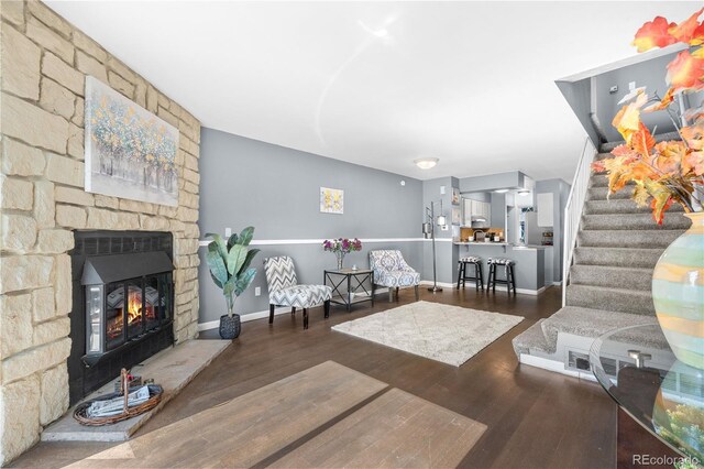 10819 Summerset Way, Parker, CO 80138 - living area with a fireplace, wood finished floors, and stairs