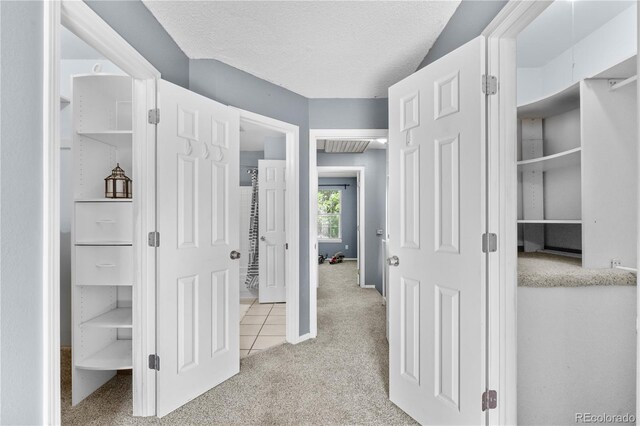 10819 Summerset Way, Parker, CO 80138 - hall with carpet flooring, tile patterned flooring, and a textured ceiling