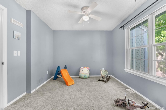 10819 Summerset Way, Parker, CO 80138 - recreation room with carpet floors, a textured ceiling, and a ceiling fan