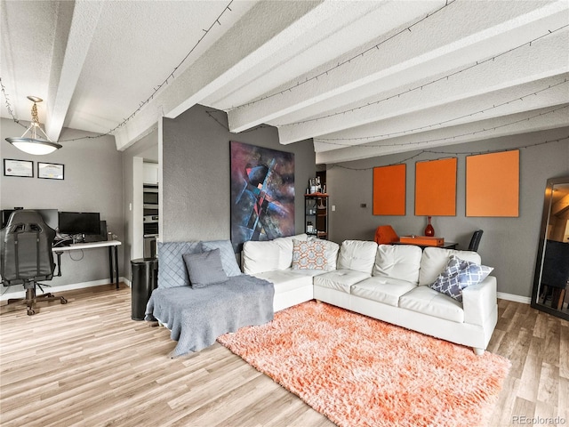 100 S Clarkson St Unit 202, Denver, CO 80209 - living room featuring light wood-type flooring, an office area, beamed ceiling, and a textured ceiling