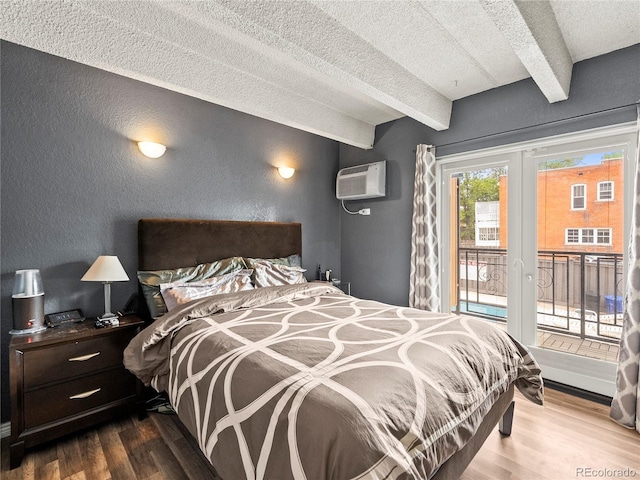 100 S Clarkson St Unit 202, Denver, CO 80209 - bedroom featuring french doors, a textured wall, access to outside, wood finished floors, and a wall mounted AC