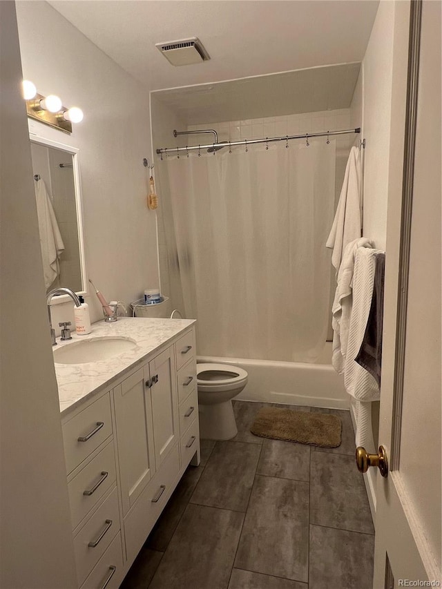 938 Racine St, Aurora, CO 80011 - bathroom featuring vanity, shower / tub combo, and tile patterned flooring