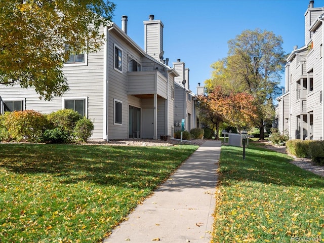 view of property's community with a yard