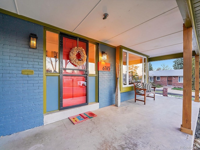 doorway to property with a porch