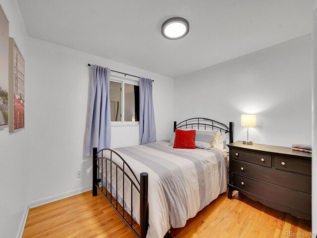 bedroom with light wood-type flooring