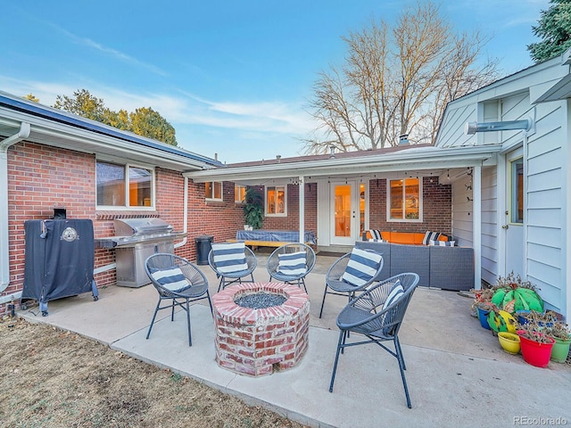 view of patio / terrace with a grill and an outdoor fire pit