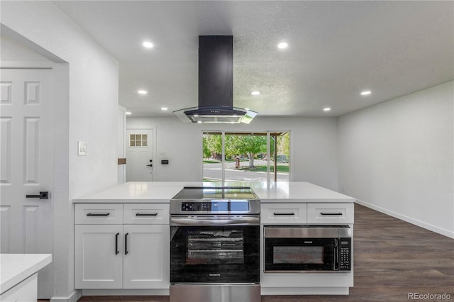 190 Hemlock St, Broomfield, CO 80020 - kitchen featuring stainless steel range with electric cooktop, island range hood, white cabinetry, recessed lighting, and light countertops