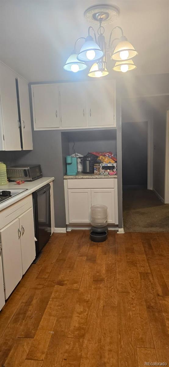 kitchen featuring white cabinetry, dark hardwood / wood-style floors, and dishwasher