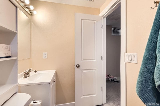 half bathroom with vanity