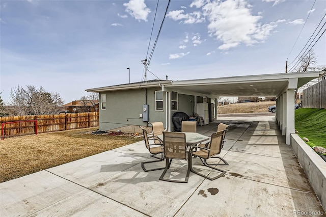 view of patio / terrace featuring outdoor dining area and fence