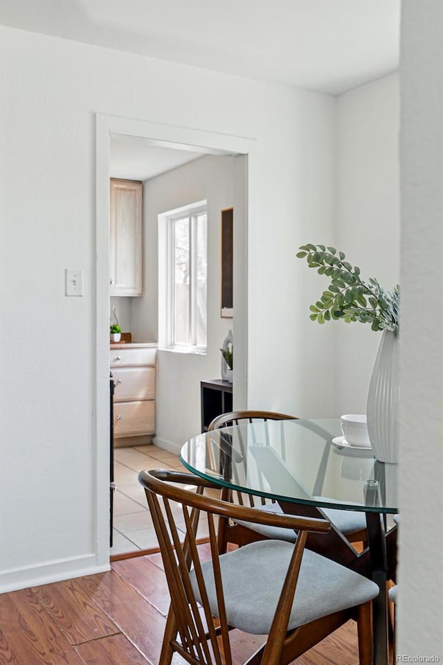 4740 Milwaukee St, Denver, CO 80216 - dining area with baseboards and light wood-type flooring