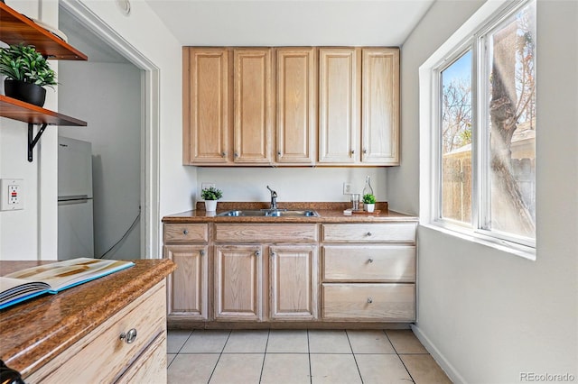 4740 Milwaukee St, Denver, CO 80216 - kitchen with a sink, open shelves, light tile patterned flooring, and dark countertops