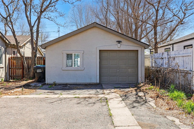 4740 Milwaukee St, Denver, CO 80216 - garage with fence and concrete driveway