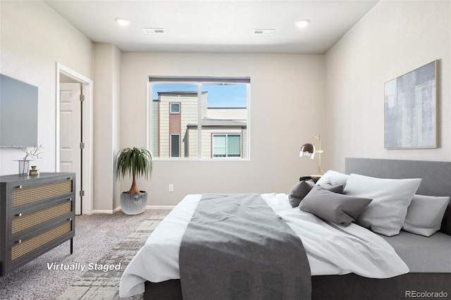 carpeted bedroom featuring baseboards