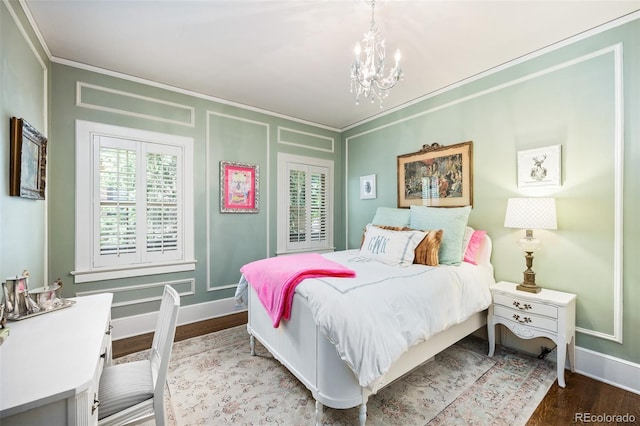 615 N Williams St, Denver, CO 80218 - bedroom with a chandelier, crown molding, wood finished floors, a decorative wall, and multiple windows