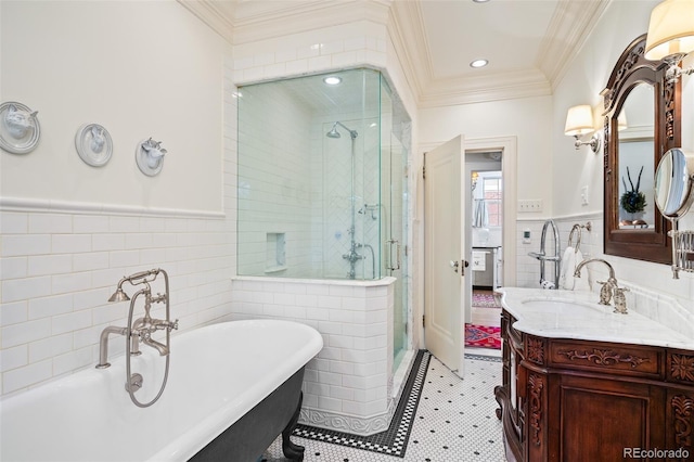 615 N Williams St, Denver, CO 80218 - full bathroom featuring tile walls, a shower stall, vanity, wainscoting, and a soaking tub