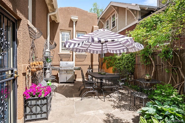 615 N Williams St, Denver, CO 80218 - fenced backyard with a patio area, outdoor dining space, and area for grilling