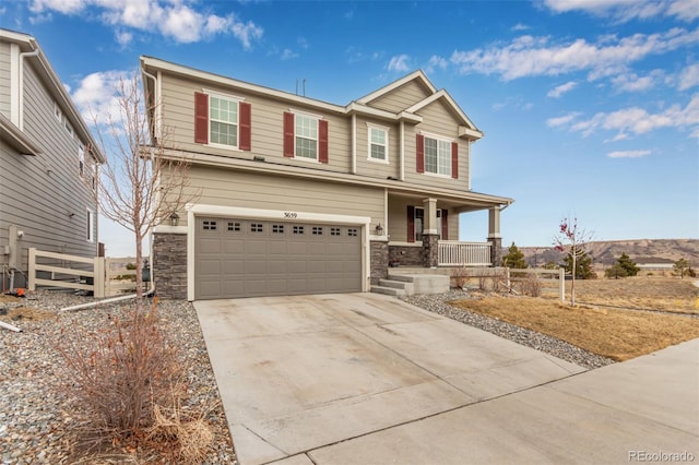 craftsman inspired home with a garage and covered porch