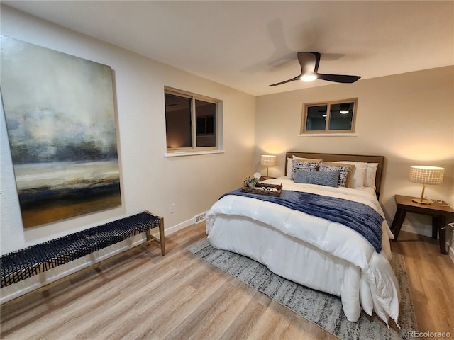 bedroom featuring ceiling fan and light hardwood / wood-style floors