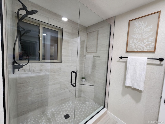 bathroom featuring an enclosed shower