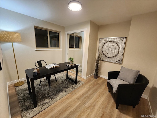 office area with light hardwood / wood-style floors