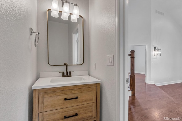 bathroom featuring vanity and hardwood / wood-style floors