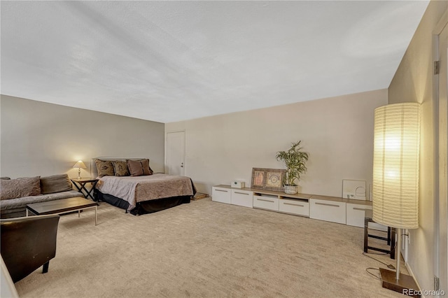 bedroom featuring light carpet