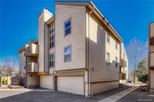 view of property exterior featuring a garage