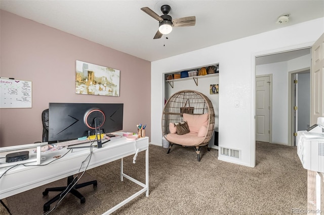 carpeted home office with ceiling fan