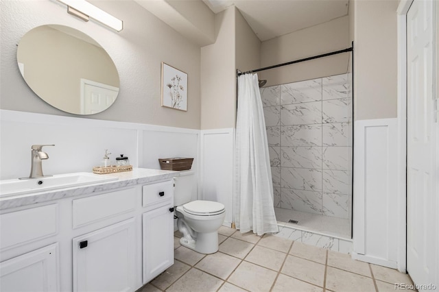 bathroom featuring vanity, toilet, and a shower with curtain