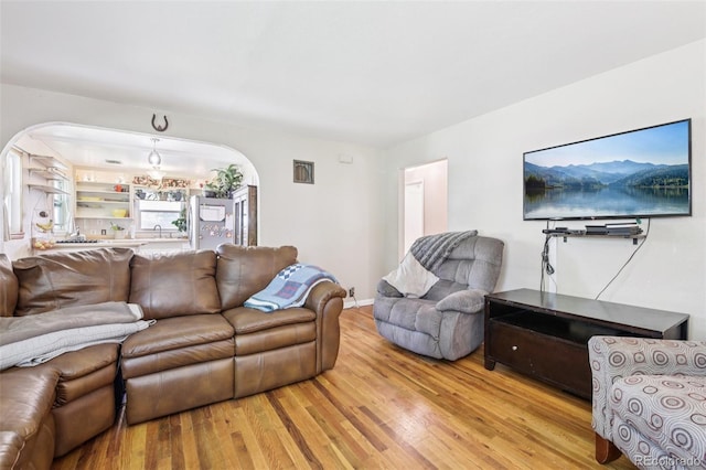 1975 Cody St, Lakewood, CO 80215 - living area with arched walkways and wood finished floors