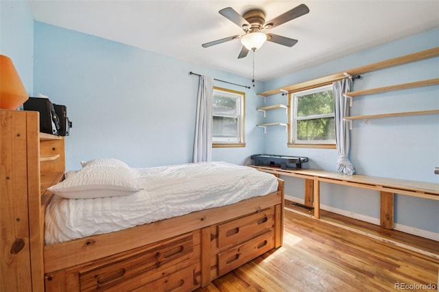 1975 Cody St, Lakewood, CO 80215 - bedroom with light wood-style floors and a ceiling fan