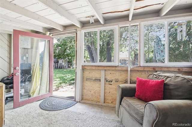 1975 Cody St, Lakewood, CO 80215 - sunroom featuring beamed ceiling and unfinished concrete floors