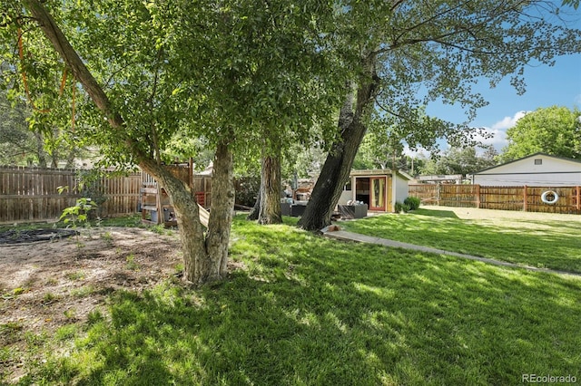 1975 Cody St, Lakewood, CO 80215 - fenced backyard featuring an outbuilding