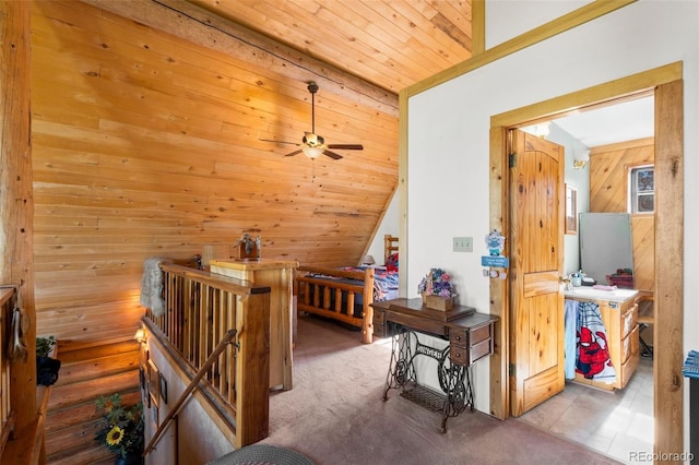 interior space with wooden ceiling, wood walls, carpet floors, and rustic walls