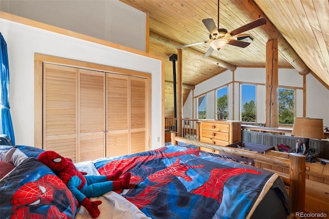 bedroom featuring a closet, ceiling fan, vaulted ceiling with beams, and wood ceiling