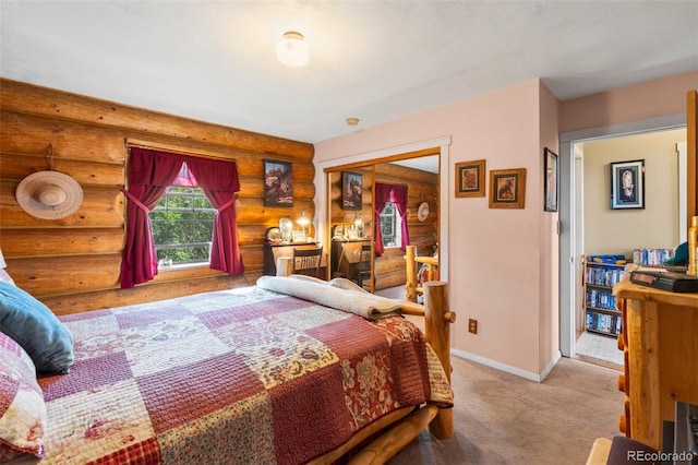 carpeted bedroom featuring rustic walls and baseboards