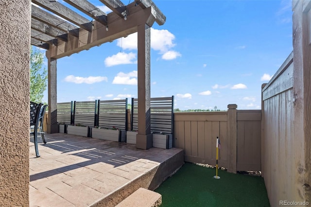 view of patio / terrace with a pergola, fence, and a putting green