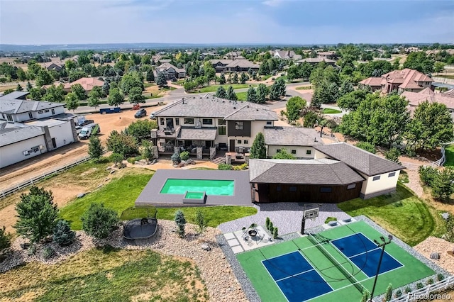 birds eye view of property with a residential view