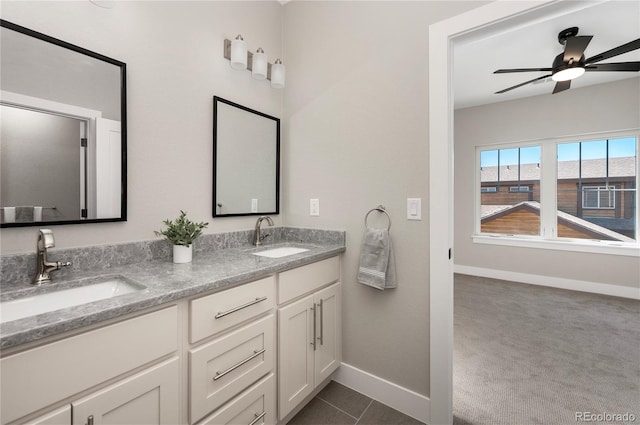 bathroom featuring tile patterned floors, ceiling fan, and vanity