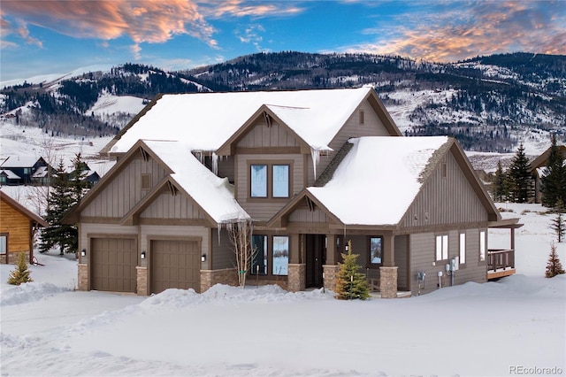 craftsman house with a mountain view and a garage