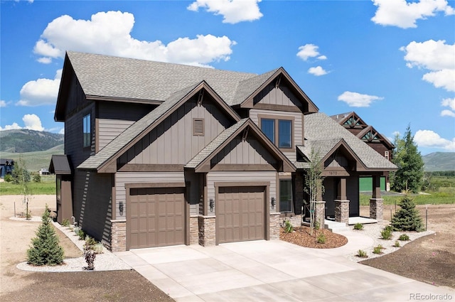 craftsman-style home featuring a mountain view and a garage