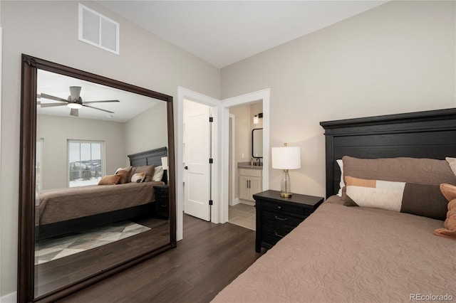 bedroom featuring ensuite bath, ceiling fan, and dark hardwood / wood-style flooring