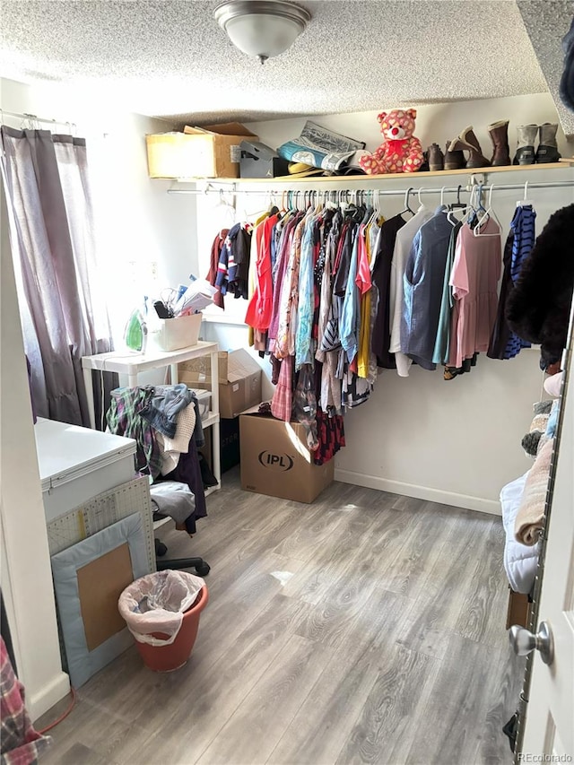 428 Prospect Ave, La Junta, CO 81050 - walk in closet featuring wood finished floors