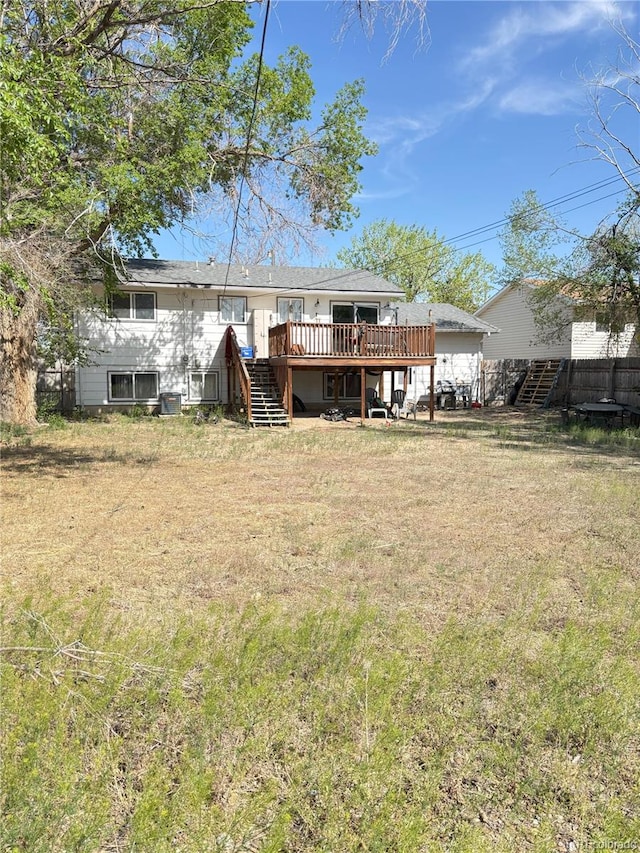 428 Prospect Ave, La Junta, CO 81050 - back of house with stairway and a wooden deck