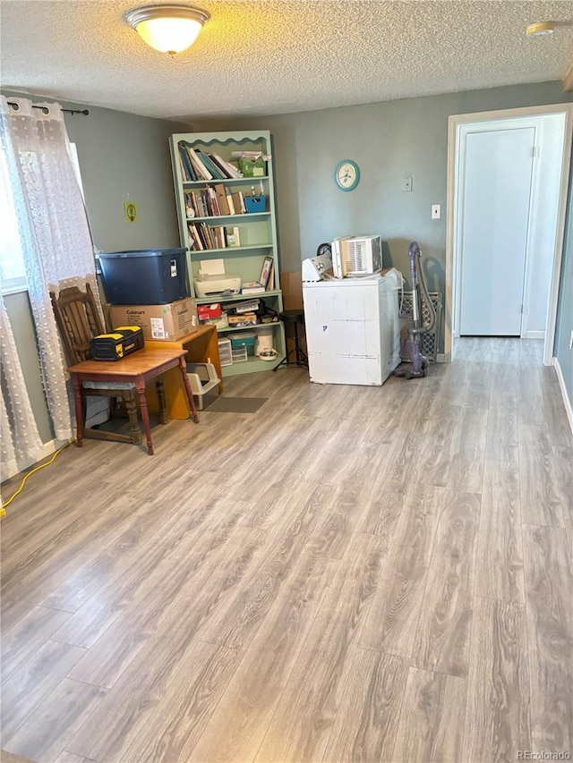 428 Prospect Ave, La Junta, CO 81050 - office space featuring a textured ceiling and wood finished floors