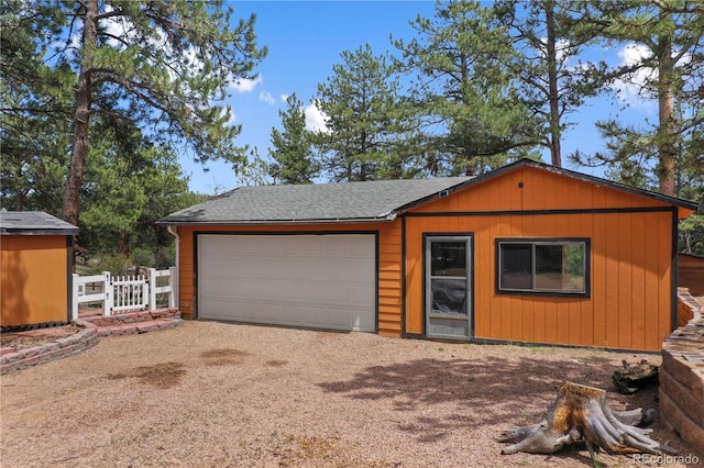 840 Obsidian Dr, Florissant, CO 80816 - view of front facade featuring driveway, an outdoor structure, and a shingled roof