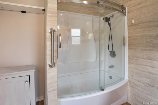 840 Obsidian Dr, Florissant, CO 80816 - full bathroom featuring bath / shower combo with glass door and wood walls