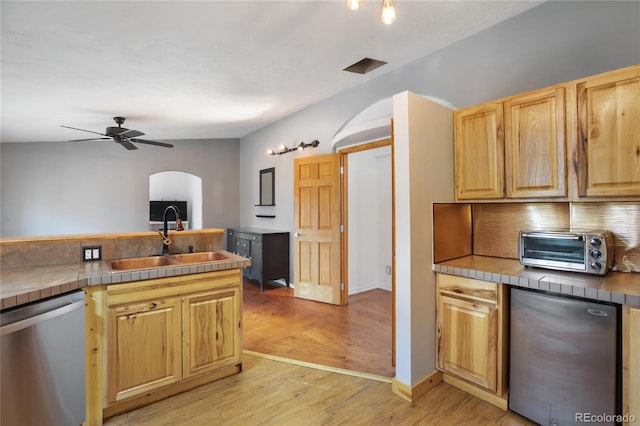 840 Obsidian Dr, Florissant, CO 80816 - kitchen with dishwasher, a sink, tile counters, ceiling fan, and light wood-type flooring