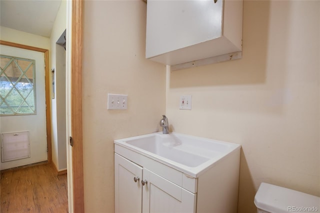 840 Obsidian Dr, Florissant, CO 80816 - bathroom featuring vanity, wood finished floors, and toilet